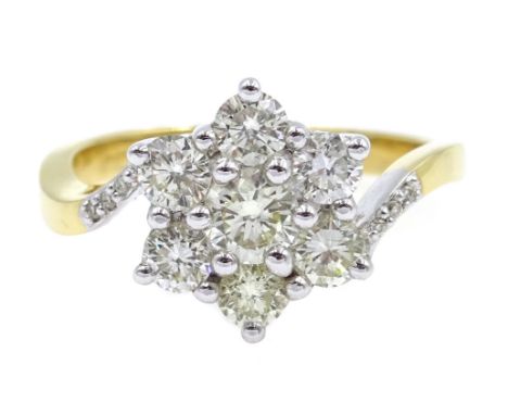 18ct gold seven stone flower cluster ring, with diamond set shoulders hallmarked, diamond total weight 1.00 carat Condition R