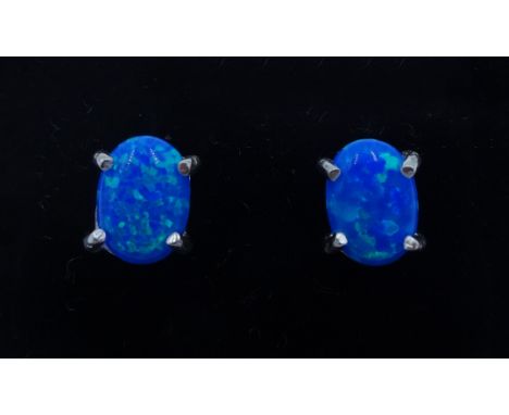 Pair of silver oval opal stud earrings, stamped 925