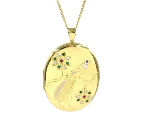 Heavy 18ct gold ruby, emerald and sapphire locket with engraved bird of paradise, perched on a branch hallmarked, on 18ct gol