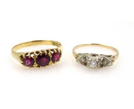 Gold three stone garnet ring, hallmarked 18ct and a gold three stone diamond ring stamped 14K 18K  Condition Report 18ct gold