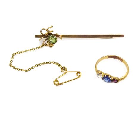 Early 20th century peridot spider brooch stamped 9ct, makers mark T &amp; AH and child's 18ct gold (tested) three stone set r