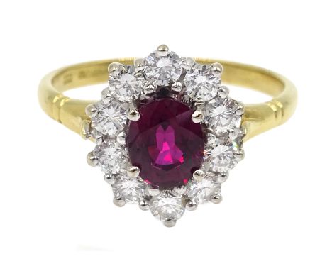 18ct gold oval ruby and round brilliant cut diamond cluster ring, hallmarked, ruby  1.07 carat Condition Report Approx 3.47gm