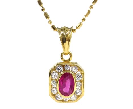 18ct gold oval ruby and diamond pendant necklace, stamped 750 Condition Report Approx 4gm, pendant = 20mm, necklace = 45.5cm