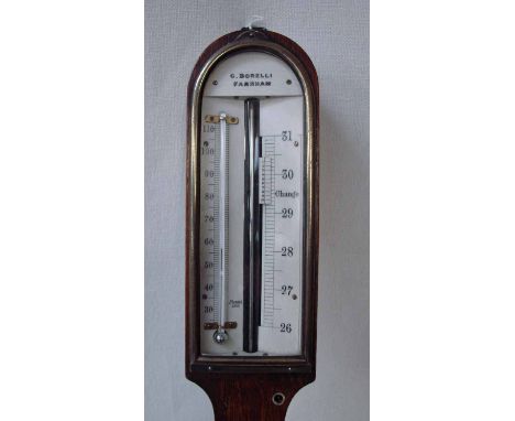 A George III oak stick barometer by C Borelli, of typical arch top form, ivory scale behind brass framed glass, integral baro