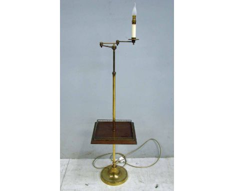 A good quality brass floor lamp, height adjustable with articulated three section swinging arm incorporating candle style ele