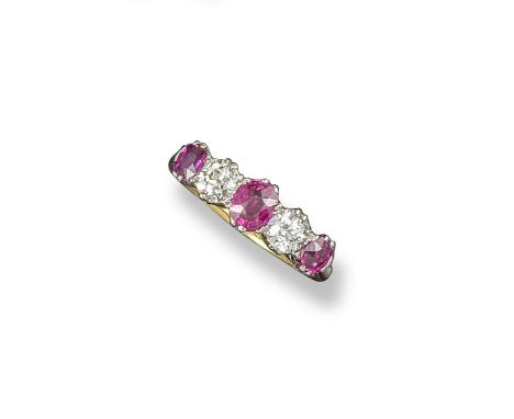 A ruby and diamond five stone ring, set with two old round circular cut diamonds and three oval-shaped rubies in gold and pla