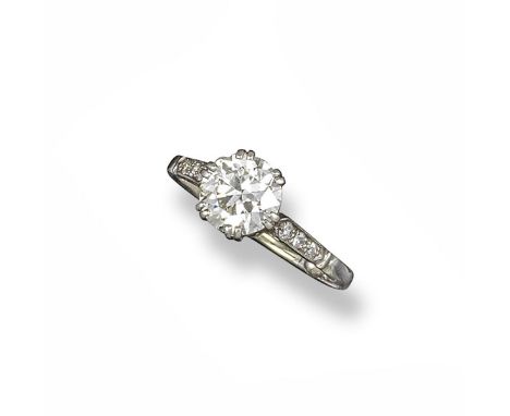 A diamond solitaire ring, the circular-cut diamond weighs approximately 1.50cts, with millegrain-set diamonds to the shoulder