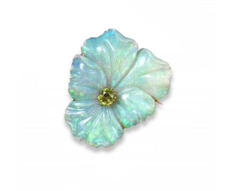 A carved opal and peridot brooch, realistically designed as a pansy with a cushion-shaped peridot to the centre. Mounted in y