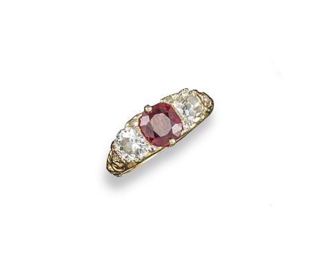 A Victorian Burmese ruby and diamond three stone ring, centred with a cushion-shaped ruby with two cushion-shaped shoulder di