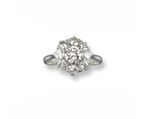 A diamond cluster ring, set with a central circular-cut diamond which weighs approximately 1.25cts, within a surround of eigh