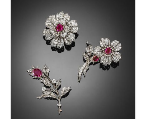 A cased set of three mid-Victorian floral brooches set with diamonds and Burmese rubies, the first brooch set with an oval-sh