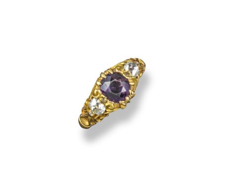 A 19th century amethyst and diamond three stone ring, the oval-shaped amethyst is set within a cushion-shaped diamond to each