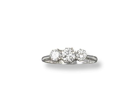 A diamond three stone ring, the three graduated old circular-cut diamonds are set in platinum. Size R 1/2.