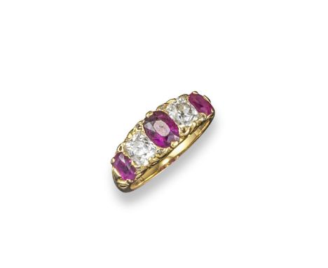 A ruby and diamond half hoop ring, alternately set with cushion-shaped diamonds and oval-shaped rubies in carved yellow gold 