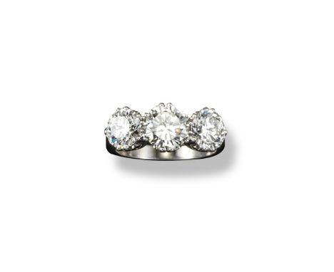 A diamond three stone ring, the three round brilliant cut diamonds weigh approximately 1.51, 1.55 and 2.14cts. Set in platinu