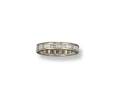 A baguette-shaped diamond set full circle eternity ring, set in white gold. Size M.