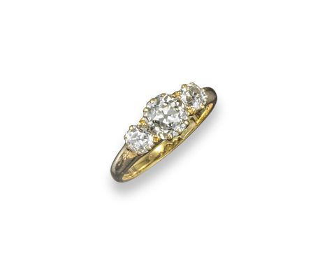 A diamond three stone ring, the three graduated old circular-cut diamonds are set in yellow gold. Size O.