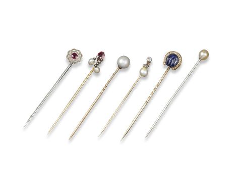 Six gem-set stick pins, including an untested pearl-mounted platinum stick pin by Cartier, signed; a ruby and diamond target 