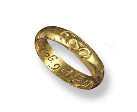 An 18th century gold memento mori memorial ring, engraved to the exterior with a skull and internally inscribed 'T Westerne o