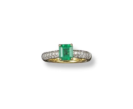 An emerald and diamond half hoop ring, set with an emerald-cut emerald on a pave-set diamond band, in yellow gold. Size M.