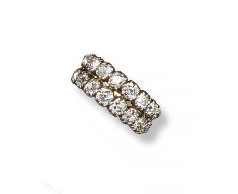 A 19th century diamond half hoop ring, the two rows of cushion-shaped diamonds are set in silver and gold. Size N 1/2.