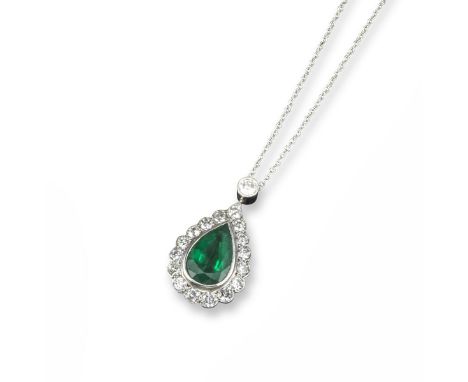 An emerald and diamond pendant, the pear-shaped emerald is set within a surround of circular-cut diamonds and suspended from 