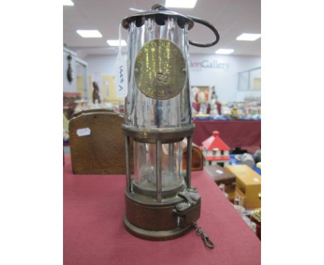 A Miners Lamp by Proctor Lamp and Lighting Co, 24.5cm high with handle down.