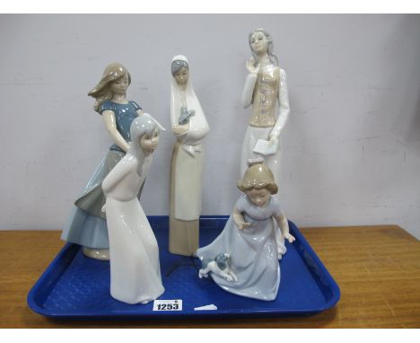Nao Girl Holding Rabbit, 26cm high, another similar as a Nun, Girl with Puppy, two other Spanish figurines. (5)
