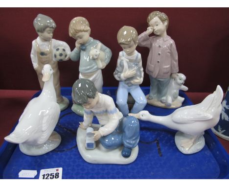 Five Nao Boy Figures, and two geese. (7)