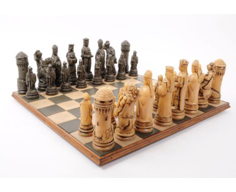 A vintage 20th century marble / slate chess set, featuring chess board, marble / resin pieces and slate / resin pieces. Piece