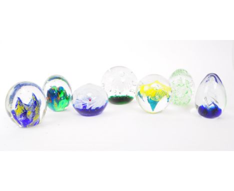 A collection of x7 vintage 20th century glass paperweights. To include bubble control, floral and swirl designs, in various c