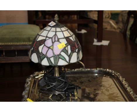 A small electric Tiffany style lamp 