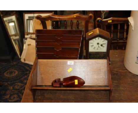 Victorian mahogany five division stationery rack with angled sides, 21 cm high, an oak book trough, a grained wood mantle clo