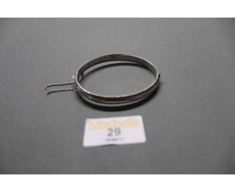 A white metal bangle with rope twist decoration, gross weight 10 grams  
