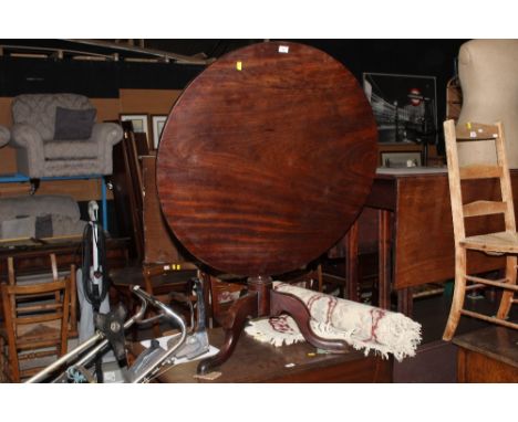 A Georgian figured mahogany tripod table 