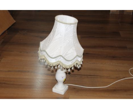 Turned alabaster table lamp with material shade