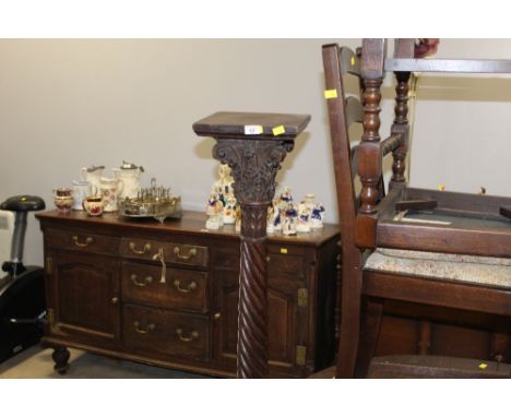 A 19th century mahogany torchere with square top, corinthian capitol, spiral column on tripod base, 150 cm high