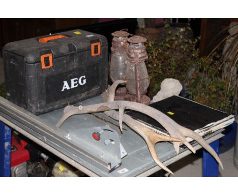 A group of mixed items, to include antlers, storm lanterns, and  AEC tool box with condense