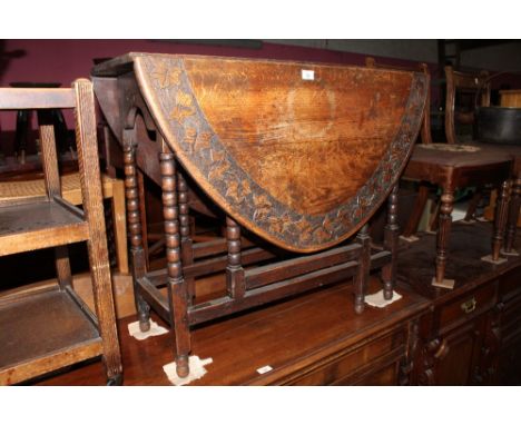 A late 19th century oak drop leaf gate leg table