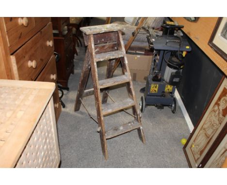 A set of vintage pine step ladders 