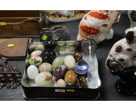 15 hard stone metal and ceramic modelled eggs and egg form paper weight and a pair of cast brass bookends " The kookaburra, A