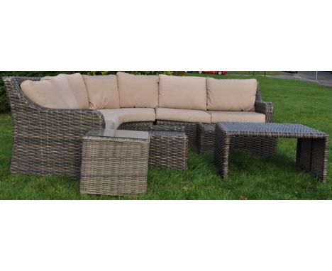 A large contemporary outdoor garden corner sofa suite by Creative Living in faux rattan plastic weave in grey colourway. The 