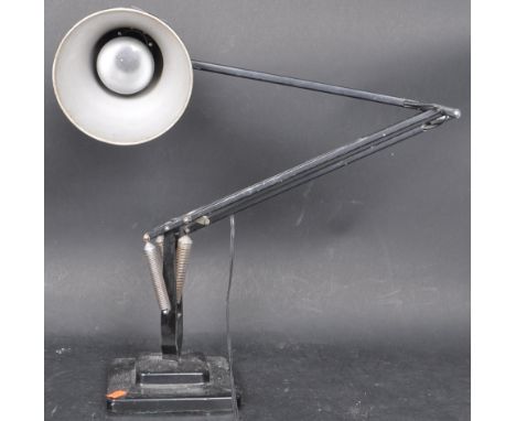 A 20th Century circa 1940's Industrial pre-war Herbert Terry anglepoise lamp, raised on a cast metal two step base with penda