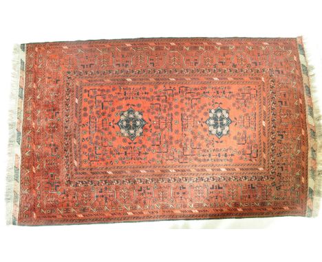 An Eastern Kurdish - Turkey 100% wool on wool carpet floor rug with pair of black medallions on red ground having decorative 