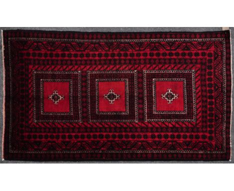 A mid 20th century wool on wool hand knotted northeast Persian / Iran Turkoman rug / carpet. The rug having three square meda