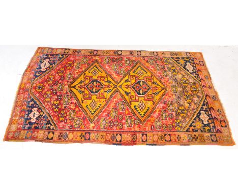 A large Avsar Sumak carpet floor rug. Wool on wool being hand knotted with central double yellow, red and black medallions me