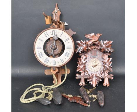 A vintage late 20th century Black Forest / German / Swiss mechanical 8 day Cuckoo clock. The clock having a Swiss Cottage sty