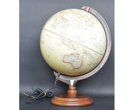 A mid 20th century desk top terrestrial globe / lamp. The spherical globe being well detailed with single arch scale gradatio