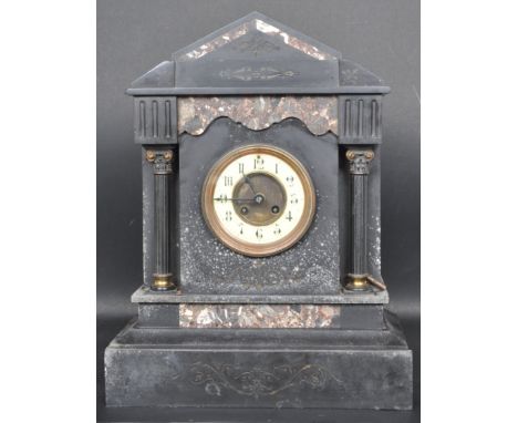 A circa 1900 early 20th century slate 8 day mantel clock of architectural form having marble embellishments with white enamel