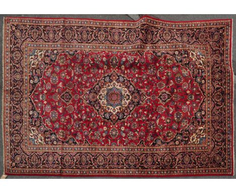 A mid 20th century wool on cotton hand knotted central Persian / Iran Kashan carpet / rug. The large carpet having a dark col